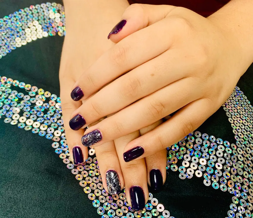 Dark manicure with glitter detail